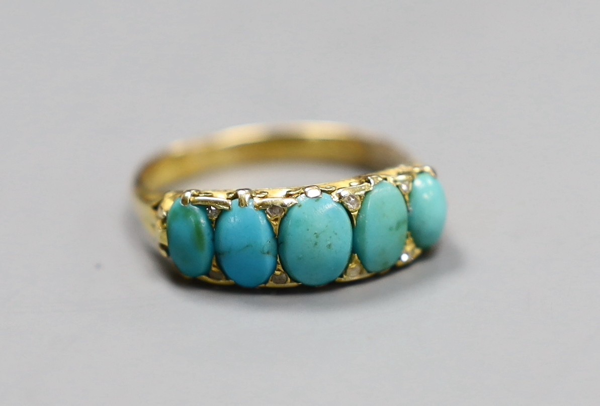 An 18ct gold turquoise set five stone half hoop ring with diamond chip intersections, size R, gross 3.5 grams